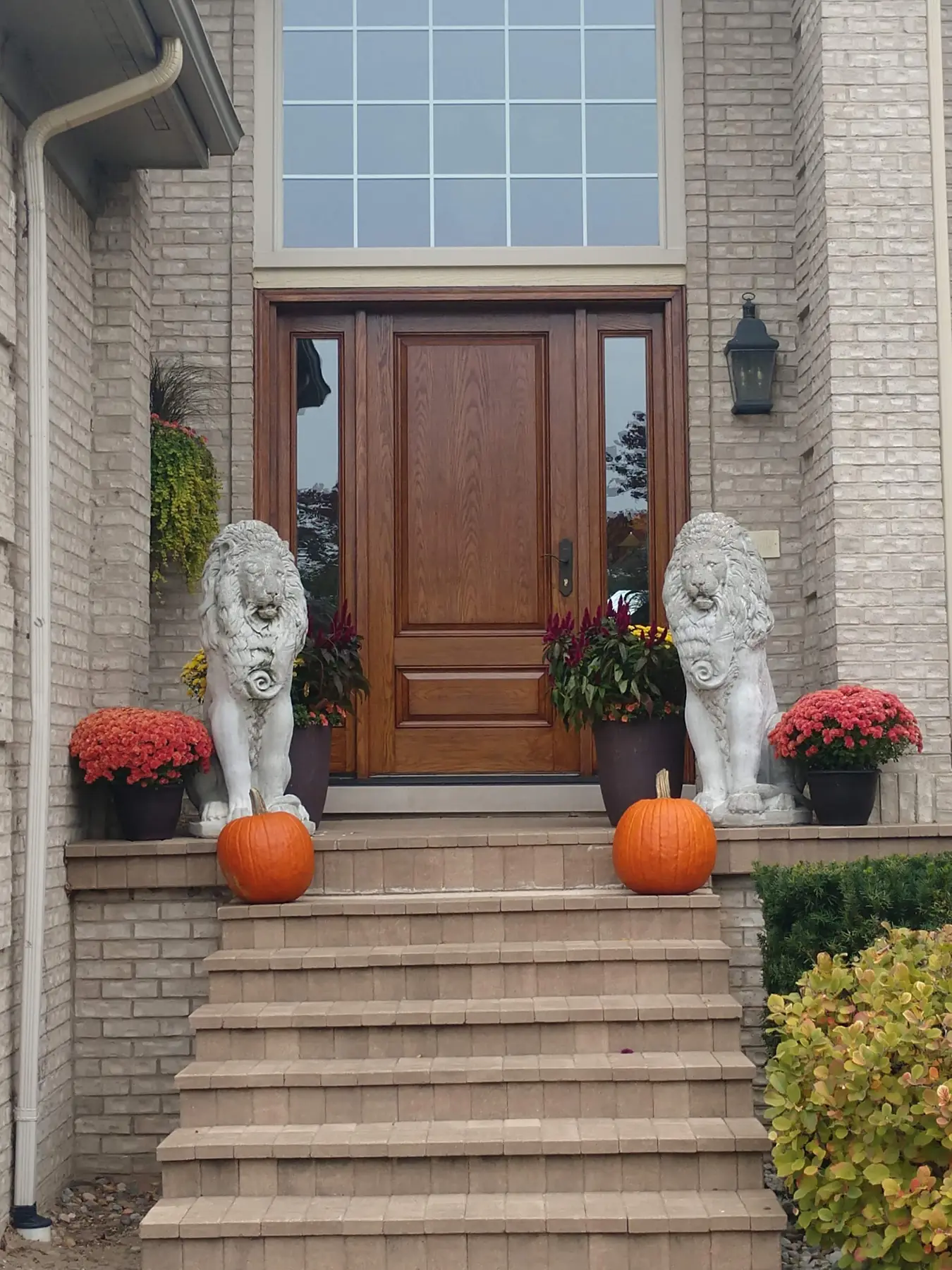 Front door, between the lions
