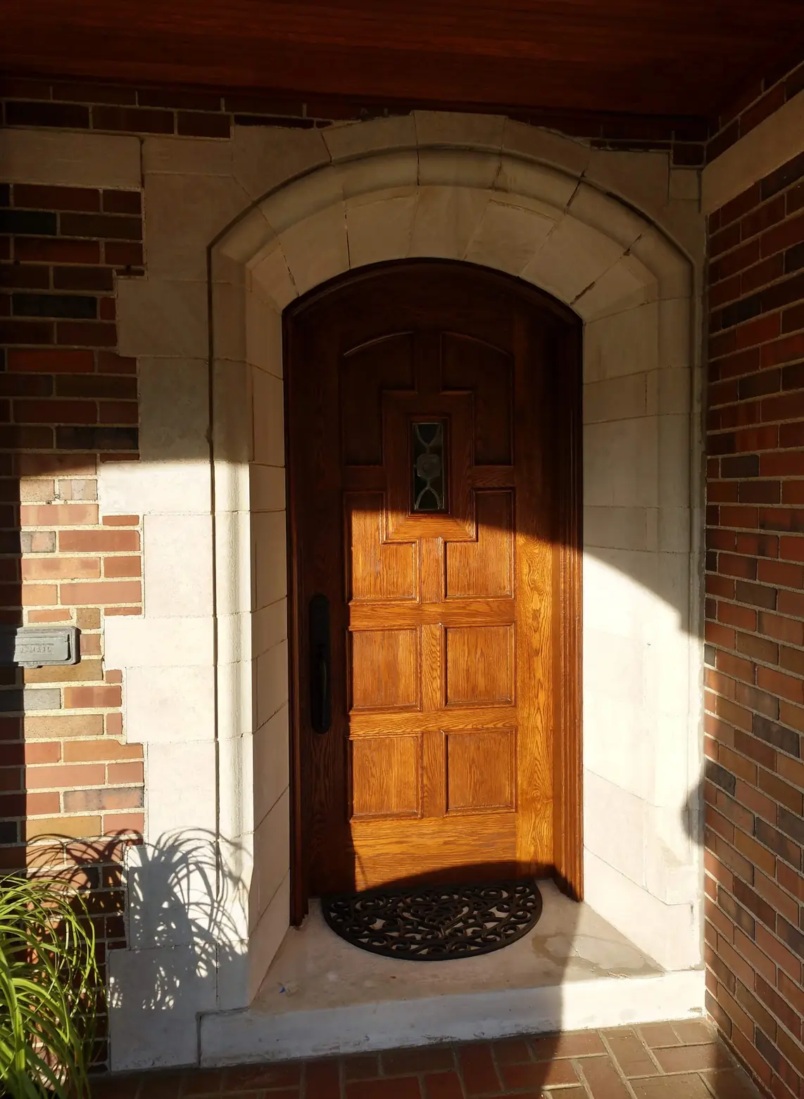 The same door after: refinished, warm wood