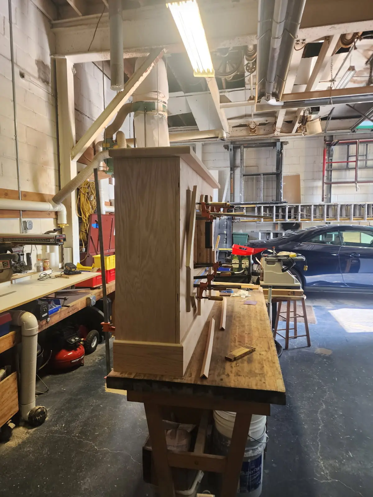 The surround seen from the side on the shop bench, clamps still on