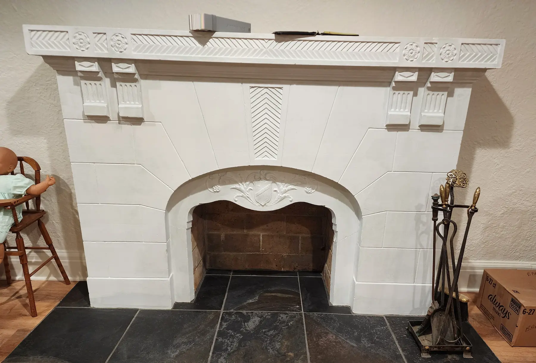 The family room fireplace before: plain white paint