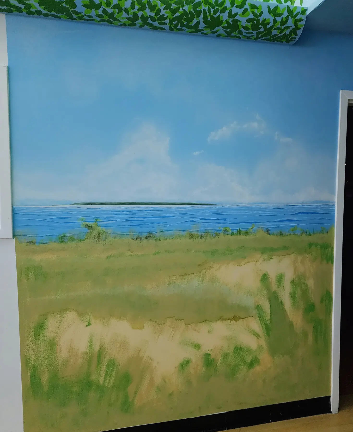 Shoreline and dune grass painted on a classroom wall